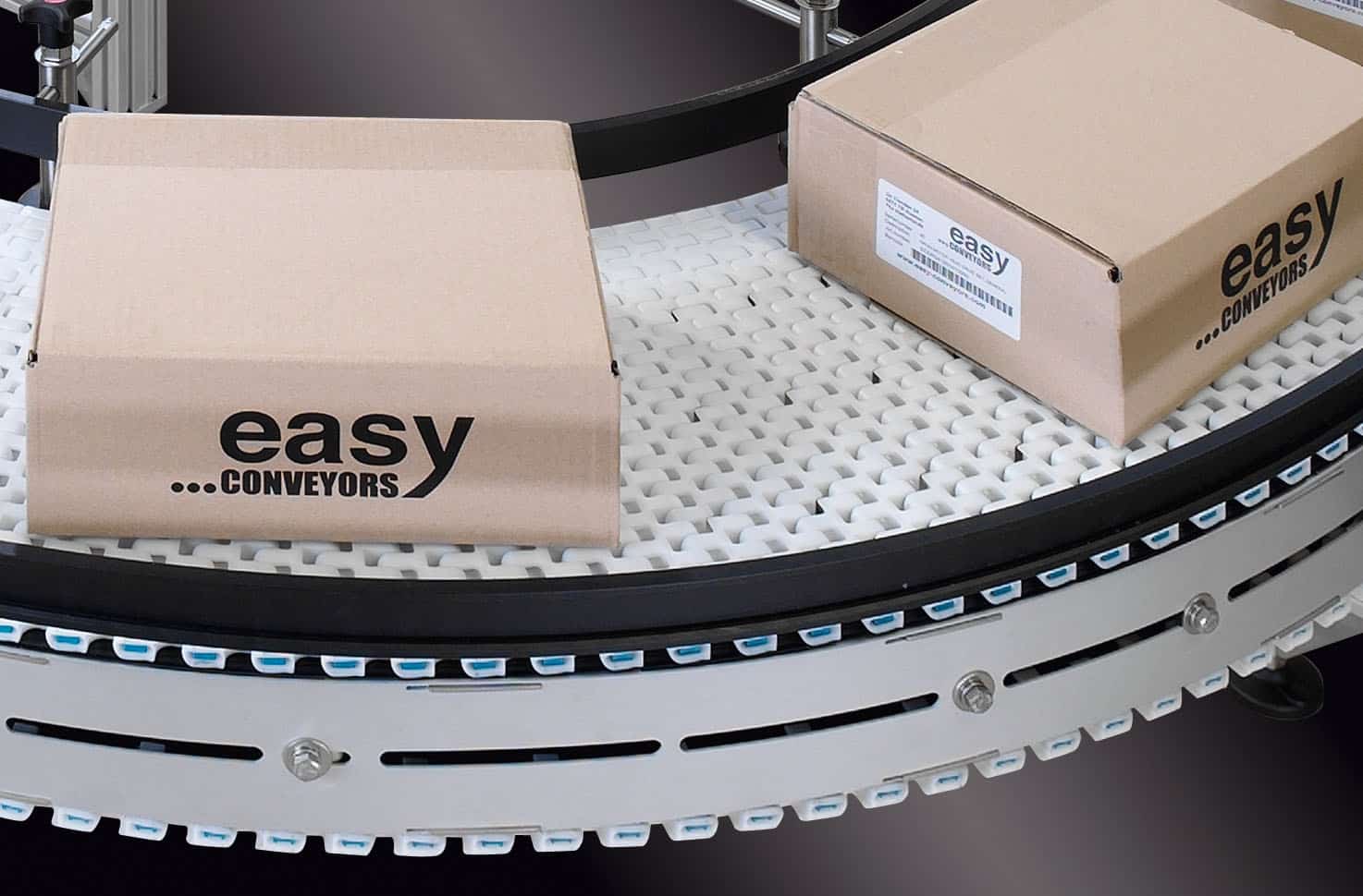 Example of curved EMBS chain conveyors, transporting cardboard boxes.